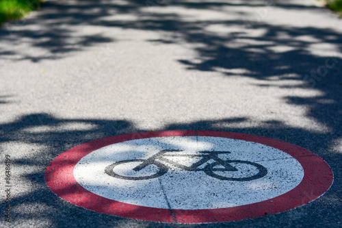 Bicycle path sign on the ground. Photo was taken on a nice sunny day, in city center of Szeged-Hungary. 