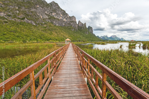 Fototapeta Naklejka Na Ścianę i Meble -  Beautiful of wooden bridge and lake in Sam Roi Yot National Park