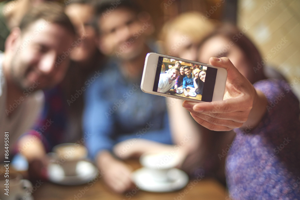 Group of friends taking selfie in the cafe Group of friends taking selfie in the cafe