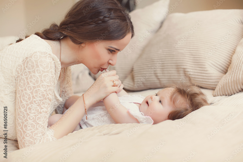 Happy mother playing with child at home Happy mother playing with child at home
