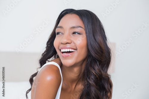 Beautiful woman smiling on bed
