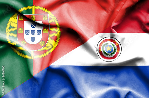 Waving flag of Paraguay and Portugal