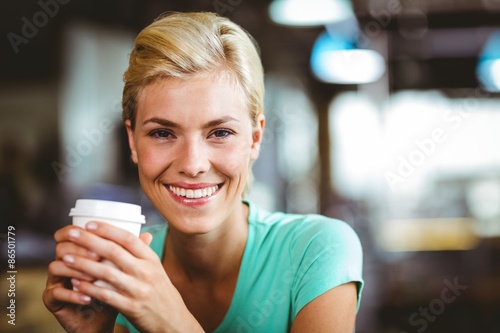 Pretty blonde holding cup of coffee 