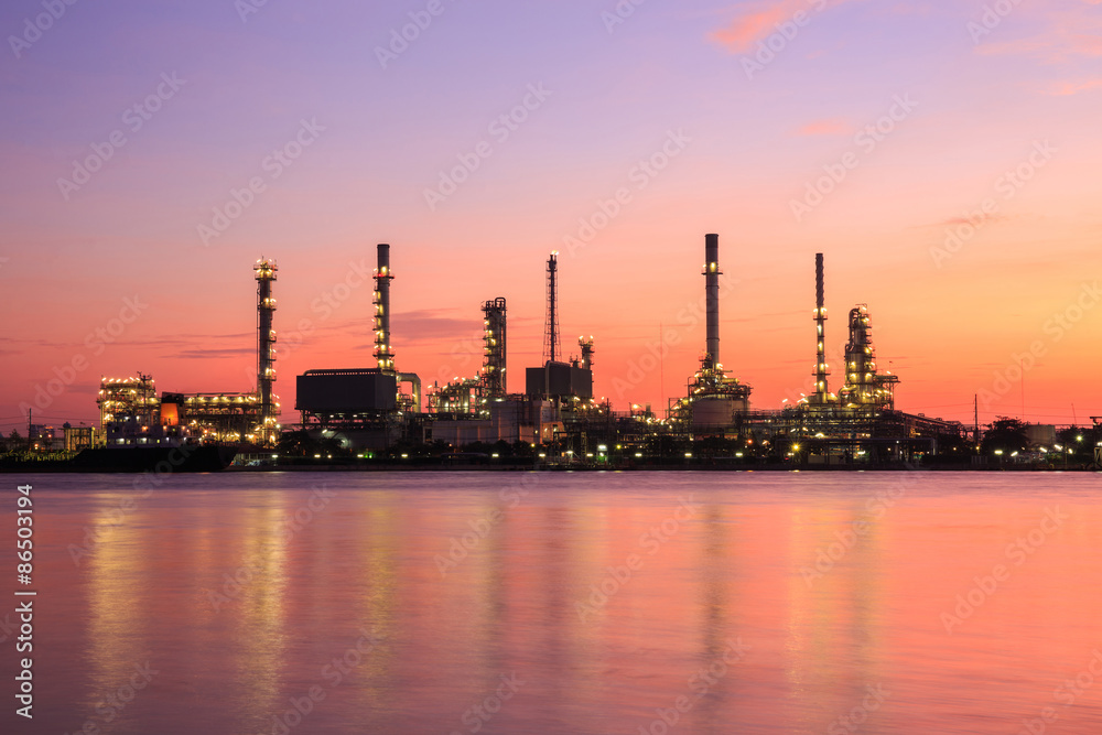 Oil refinery silhouette along the river at sunrise time (Bangkok, Thailand)