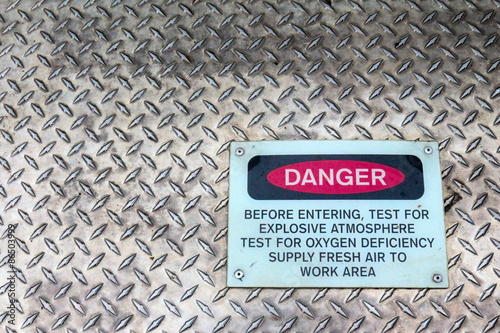 Danger sign on a confined space sign warning of explosive atmosphere