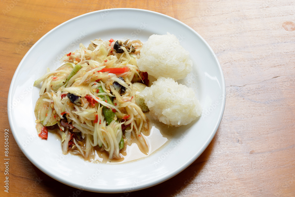 Green papaya salad (Som Tum) with sticky rice Green papaya salad (Som Tum) with sticky rice
