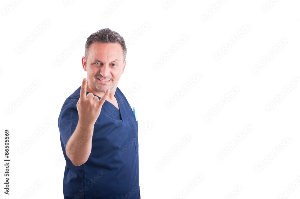 Young and cool doctor making rock gesture or symbol Young and cool doctor making rock gesture or symbol