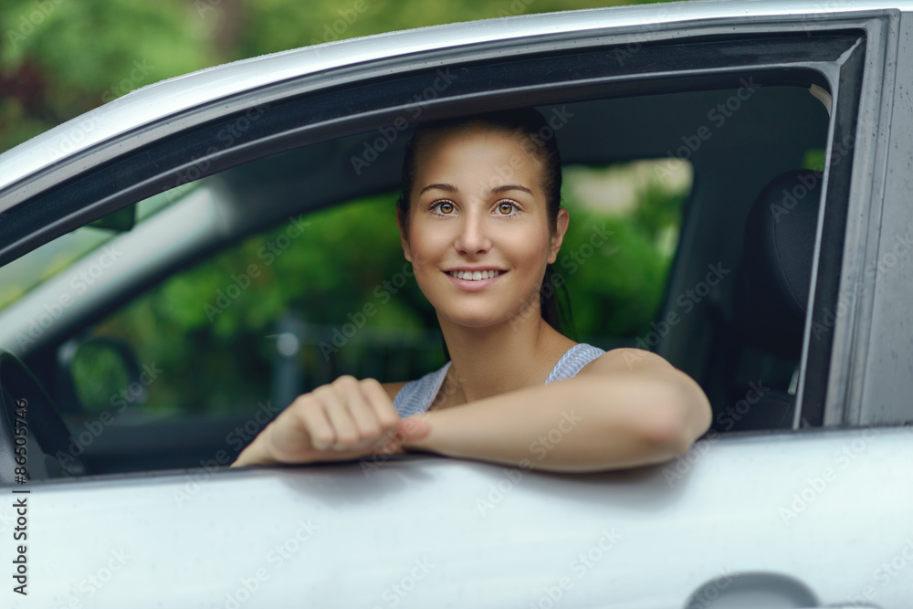 Smiling Pretty Woman Leaning on Car Window