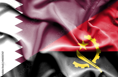 Waving flag of Angola and Qatar