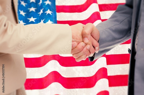 Composite image of close up of people shaking hands