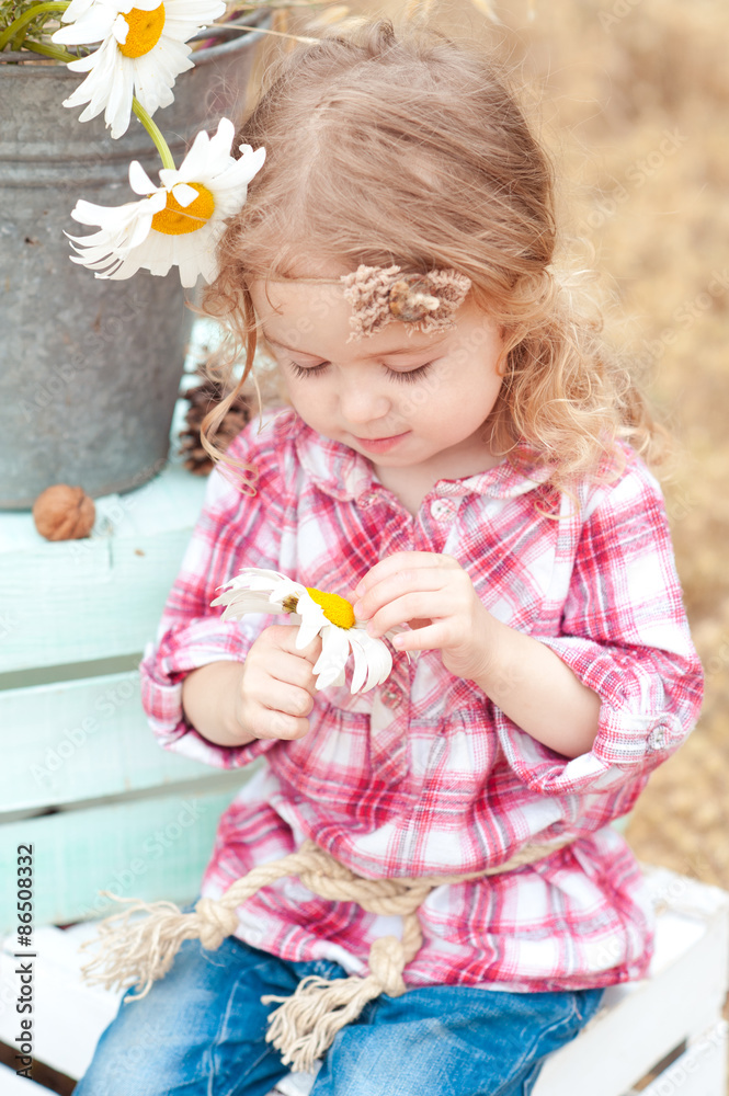 Cute kid girl 2-3 year old holding flower outdoors. Childhood. Cute kid girl 2-3 year old holding flower outdoors. Childhood.