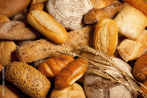 assortment of baked bread with wheat