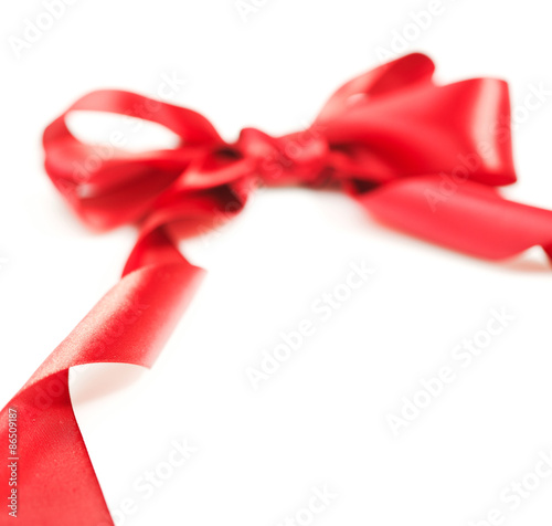 Red gift ribbon bow on white background