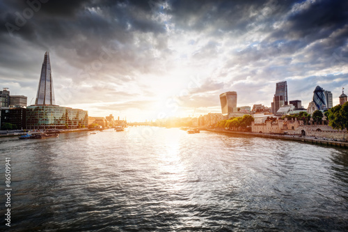 London skyline at sunset, England the UK. River Thames, the Shard, City Hall. photo