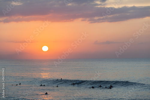 Fényképezés Surfing Sunrise surfers silhouetted ocean wave landscape