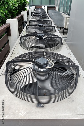 Row of Residential air conditioner compressor units in The Garden