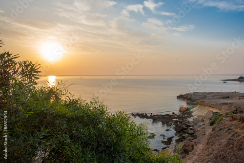 Rocky sea shore on the beautiful sunrise