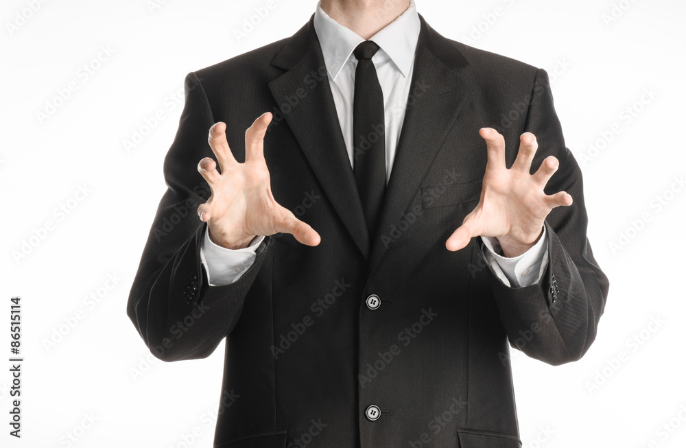 Businessman and gesture topic: a man in a black suit with a tie showing hands gesture on an isolated white background in studio Businessman and gesture topic: a man in a black suit with a tie showing hands gesture on an isolated white background in studio