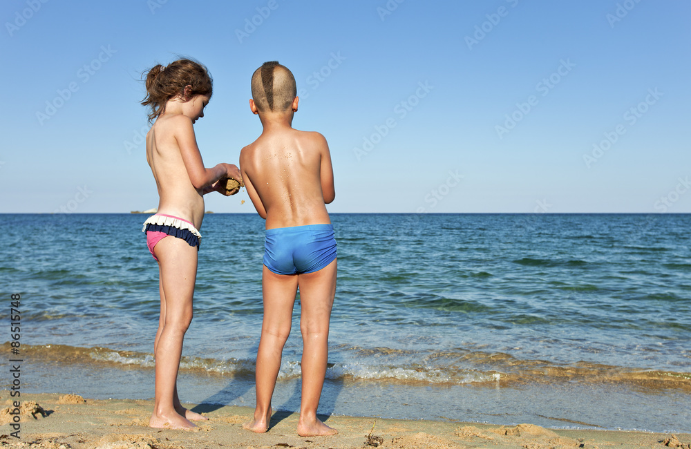 kids sharing childhood remote beach
