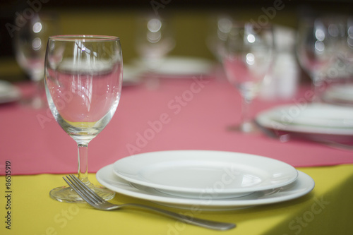 Empty glasses and plate in restaurant