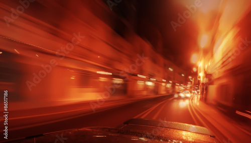 Fast driving by night - motion blur red