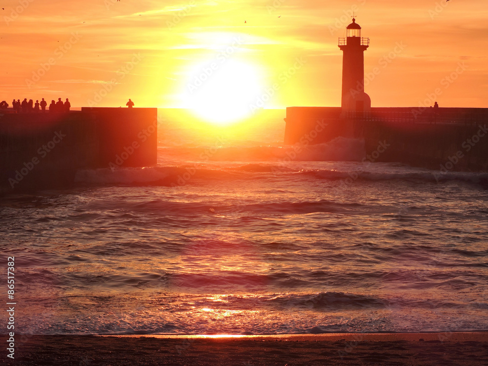 Orange sunset with lighthouse
