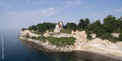 Aerial view of Stevns cliff and Hoejerup Old Church, Denmark photo