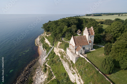 Aerial view of Stevns cliff and Hoejerup Old Church, Denmark photo