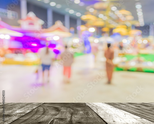 Blurred image of people walking at shopping mall
