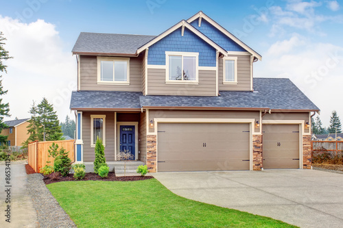 Beautiful traditional home with driveway. © Iriana Shiyan