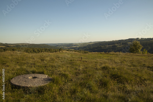 An old millstone at Longshaw in the Peak District, UK photo