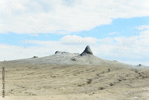 Mud volcano refers to formations created by geo-exuded slurries and gases.