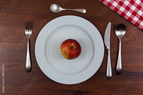 apple on a white plate