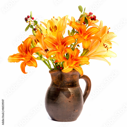Fototapeta Naklejka Na Ścianę i Meble -  Asiatic Hybrids orange lilys bouquet in a brown vase isolated on white background