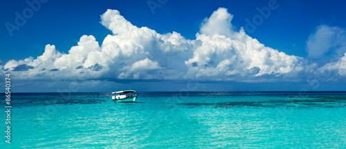 Boat in the lagoon of paradise in the Caribbean
