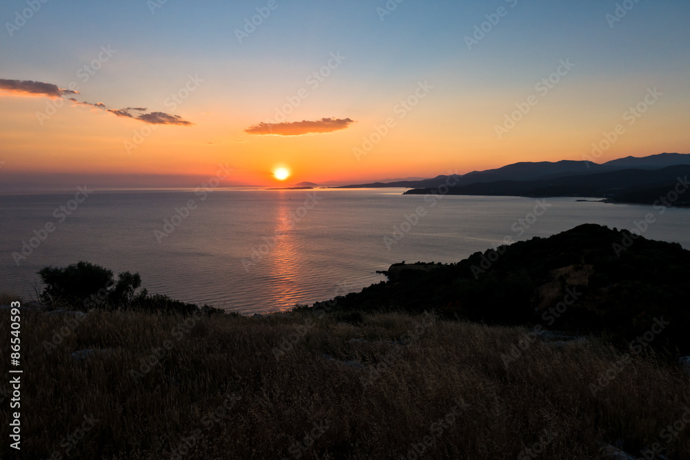Sunset at Toroni bay near old roman fortress, Sithonia