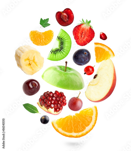 Falling fresh fruits and berries