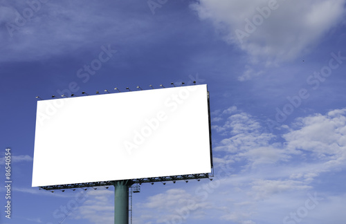 advertisement bill board with blue sky in background.