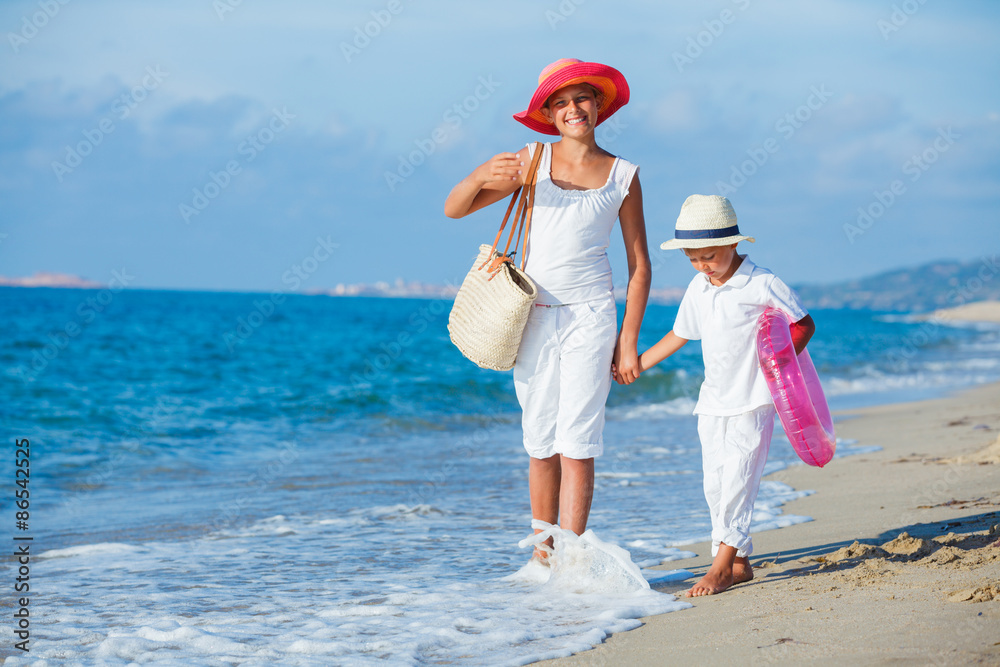 Kids walking at the beach