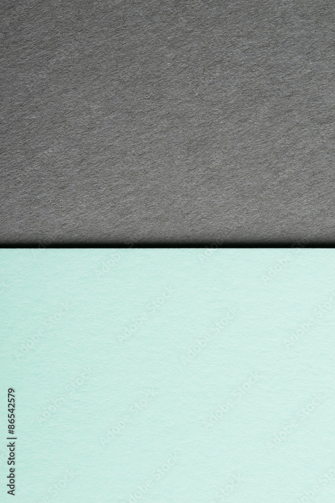 Mint color paper sheet over the grey background