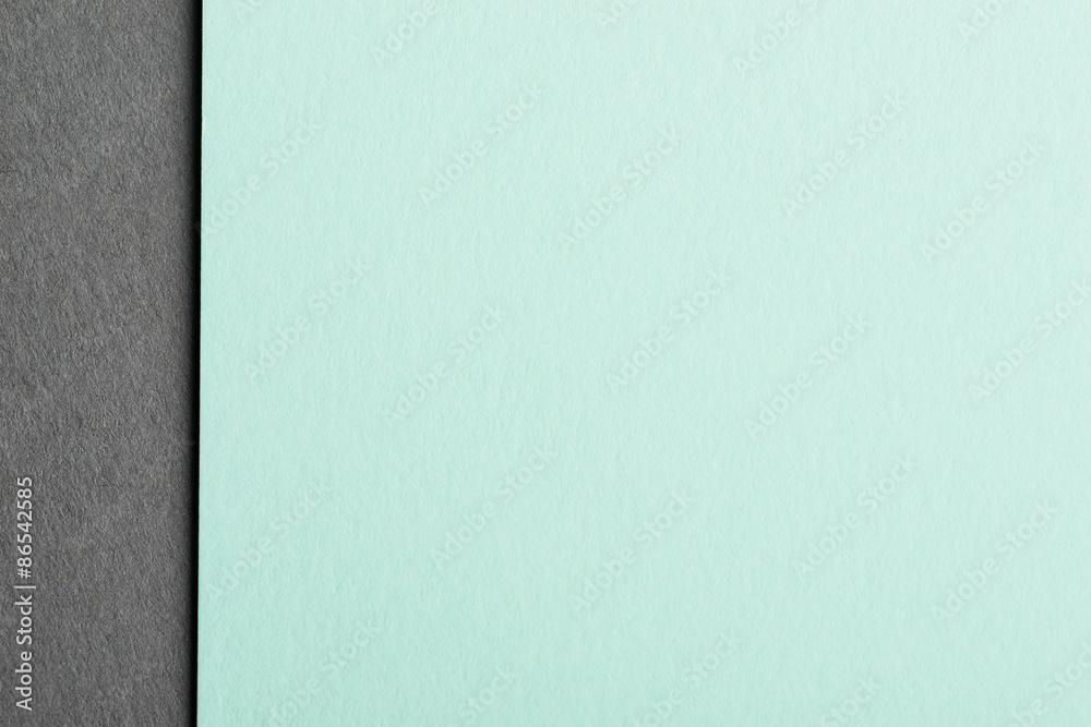 Mint color paper sheet over the grey background