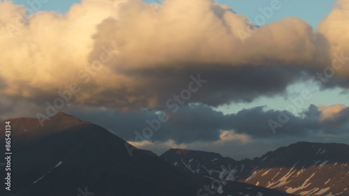 Fast clouds over the mountain3/Low clouds moving quickly over the Northern mountains. Of the Ural mountains. The Polar Urals. Time lapse. Summer.  photo