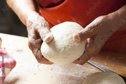 Hands making a pizza dough photo