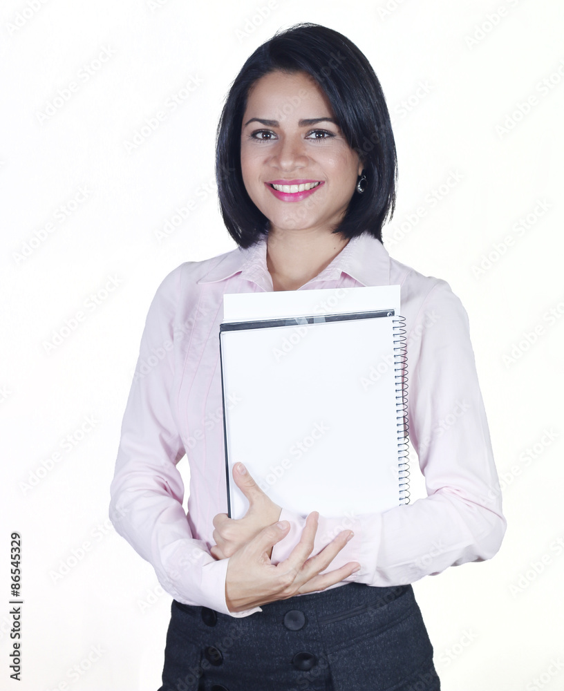 Young business woman smiling and holding notebook Young business woman smiling and holding notebook