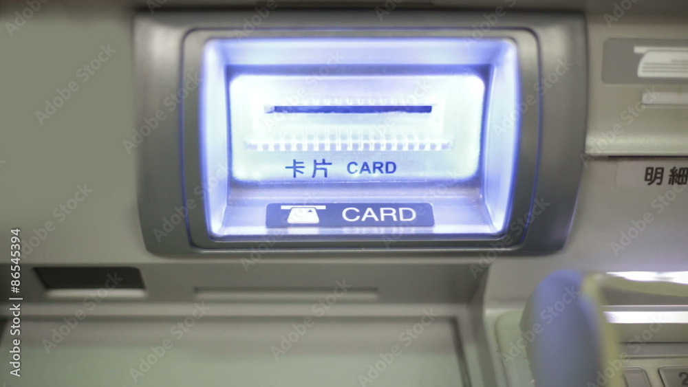 Inserting bankcard at ATM Inserting bankcard at ATM