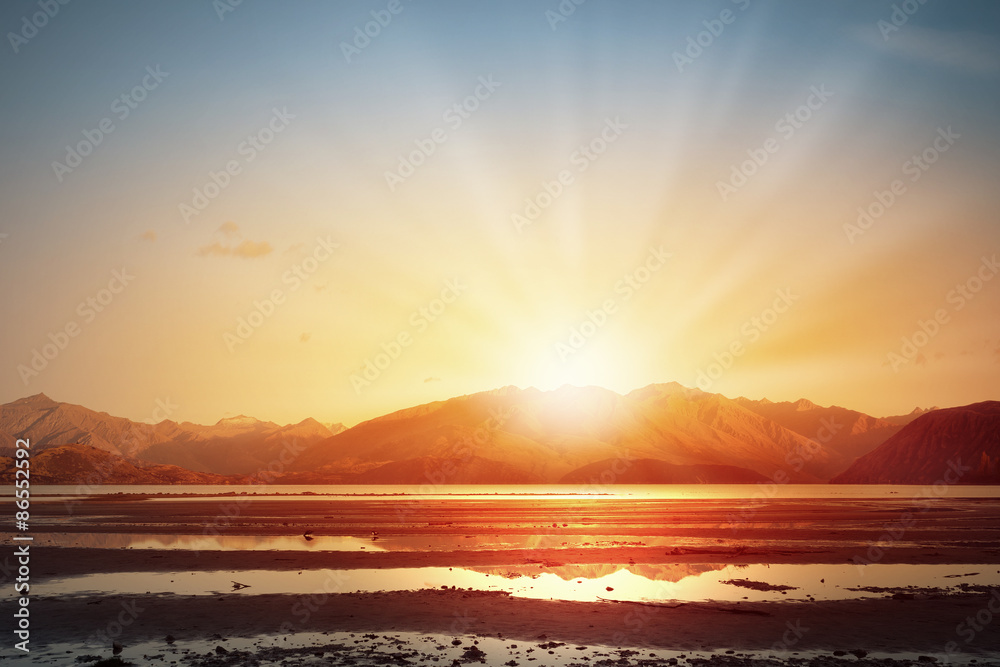 Naklejka premium Sunset above road