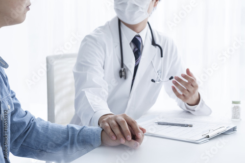 Doctors are encouraged to hold the hand of a patient photo
