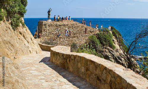 Nice coastline view in Lloret de Mar in Spain with an old brick road photo