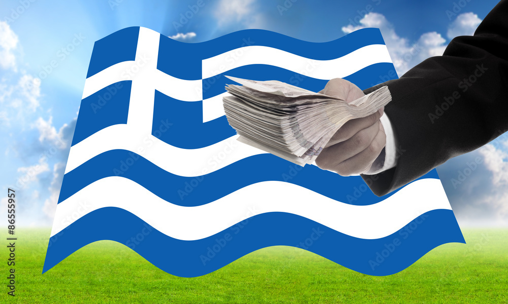 Obraz premium Businessman offer money to help Greece, Financial Crisis in Gree