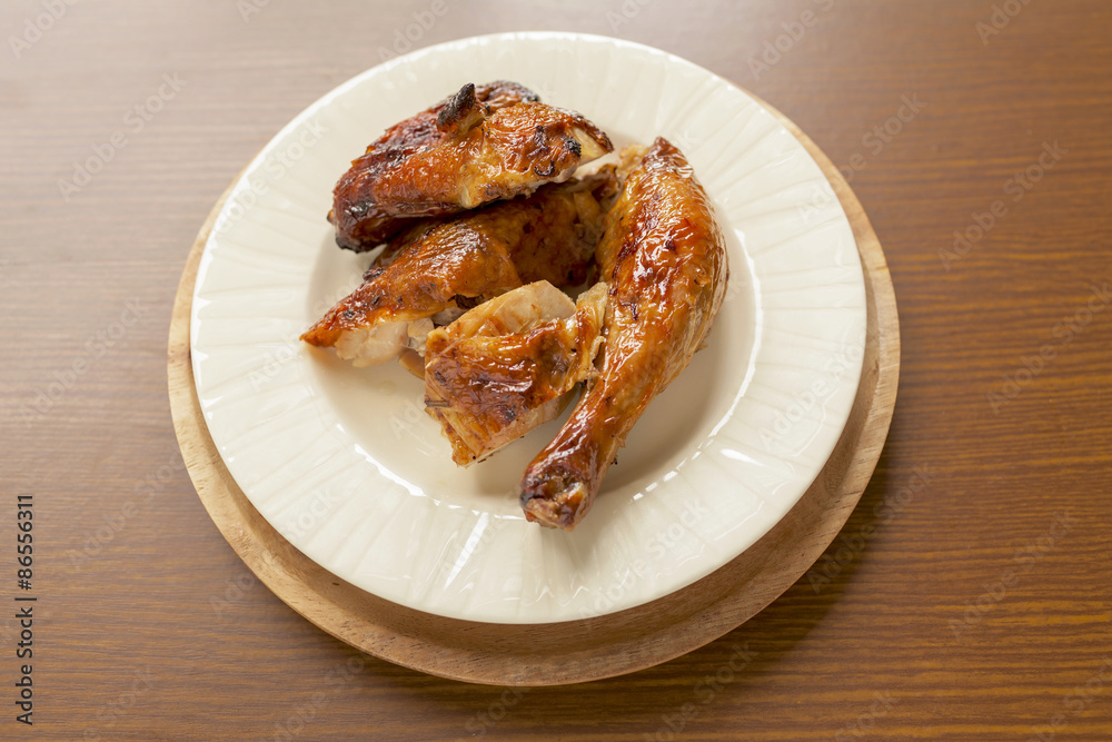 Grill chicken thai style on wood background Grill chicken thai style on wood background